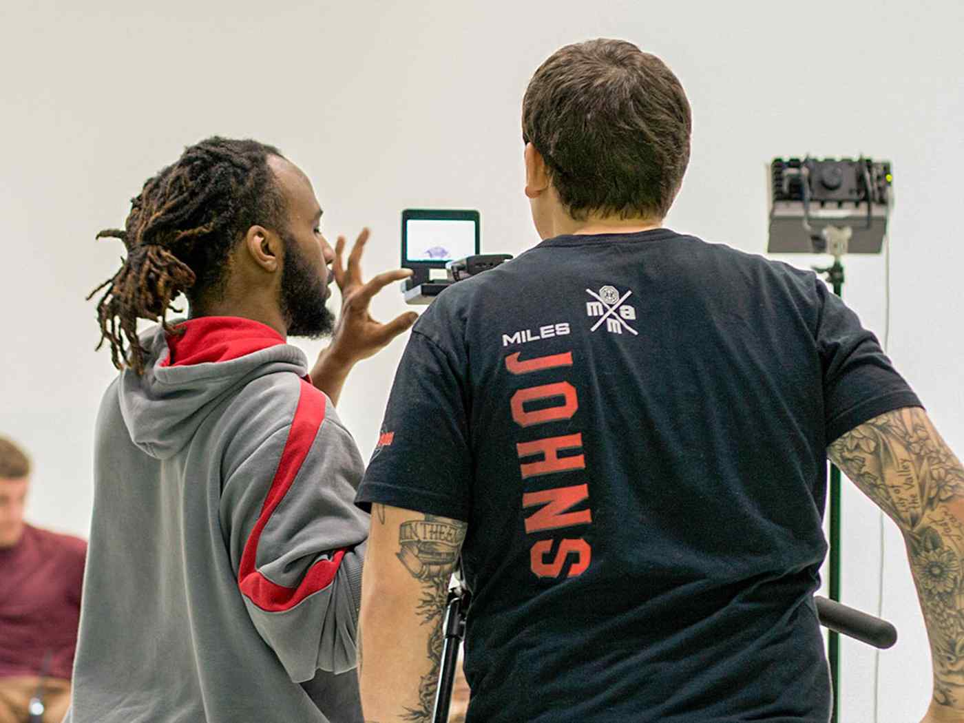 Two students recording in the studio.