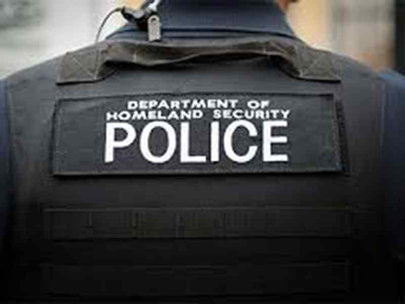 Back of homeland security police officer