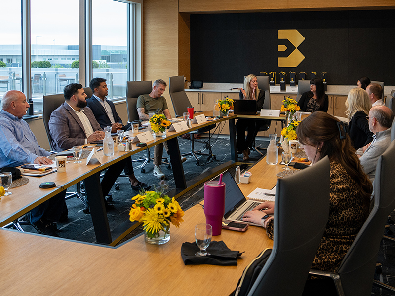 Members of the Barton School Hospitality Advisory Board seated around a conference table.