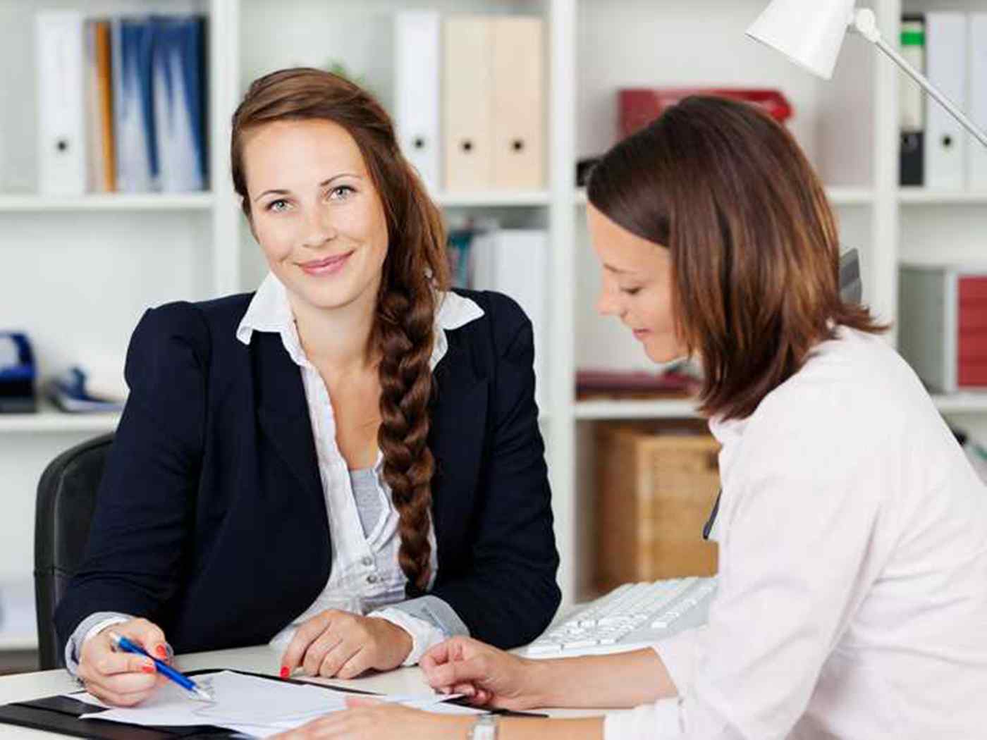 Two human Resources professionals working in an office setting