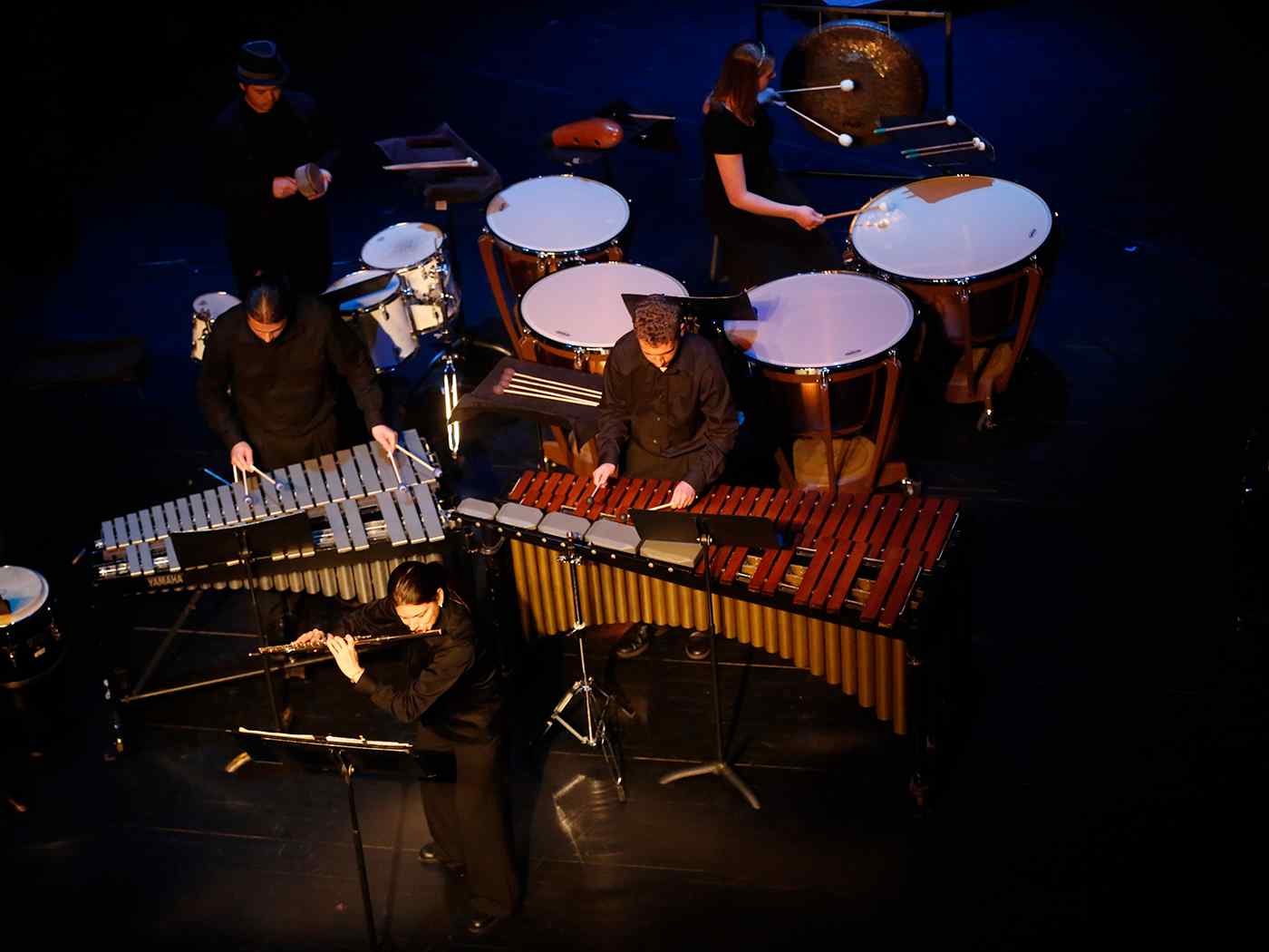 Students playing their instruments on stage.