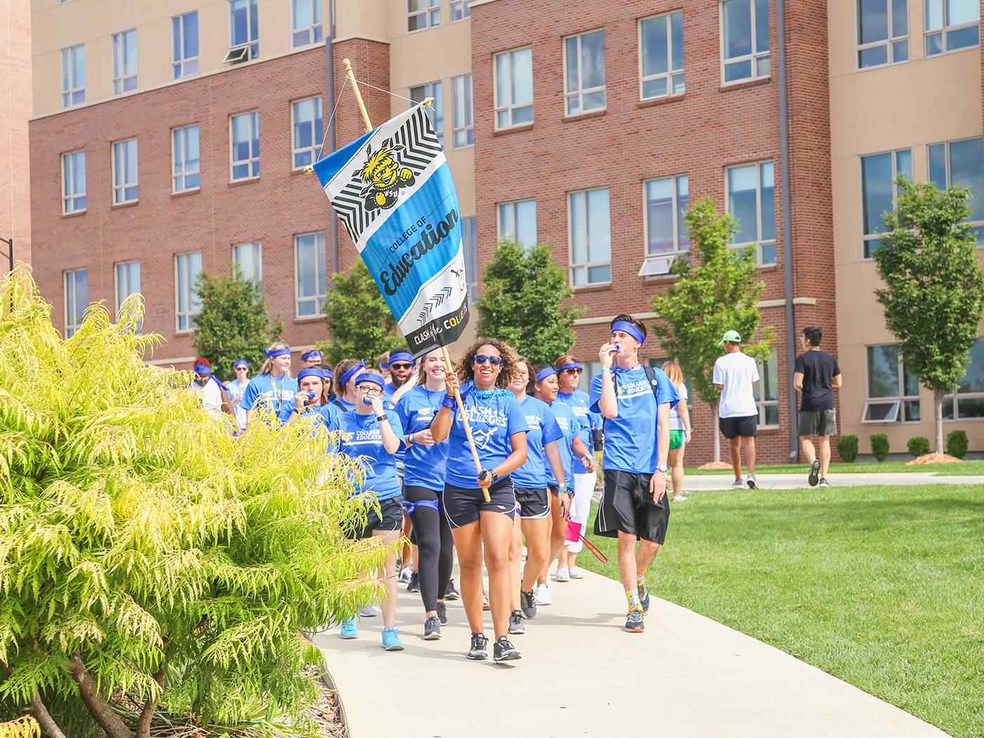 Students marching to clash of colleges.