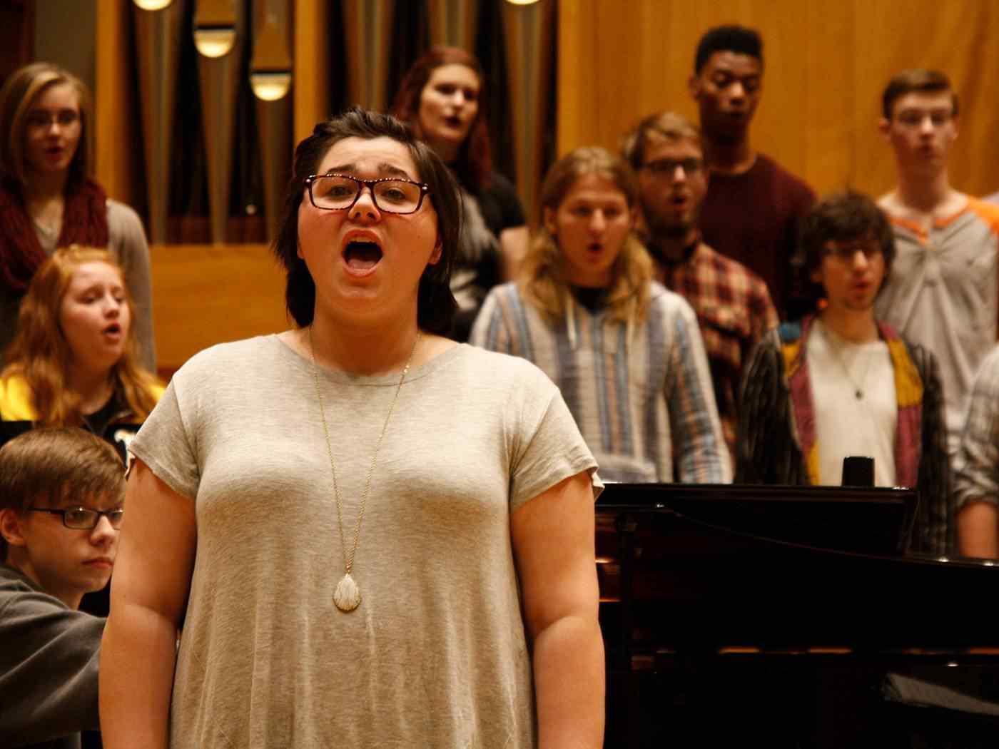 Female student singing.