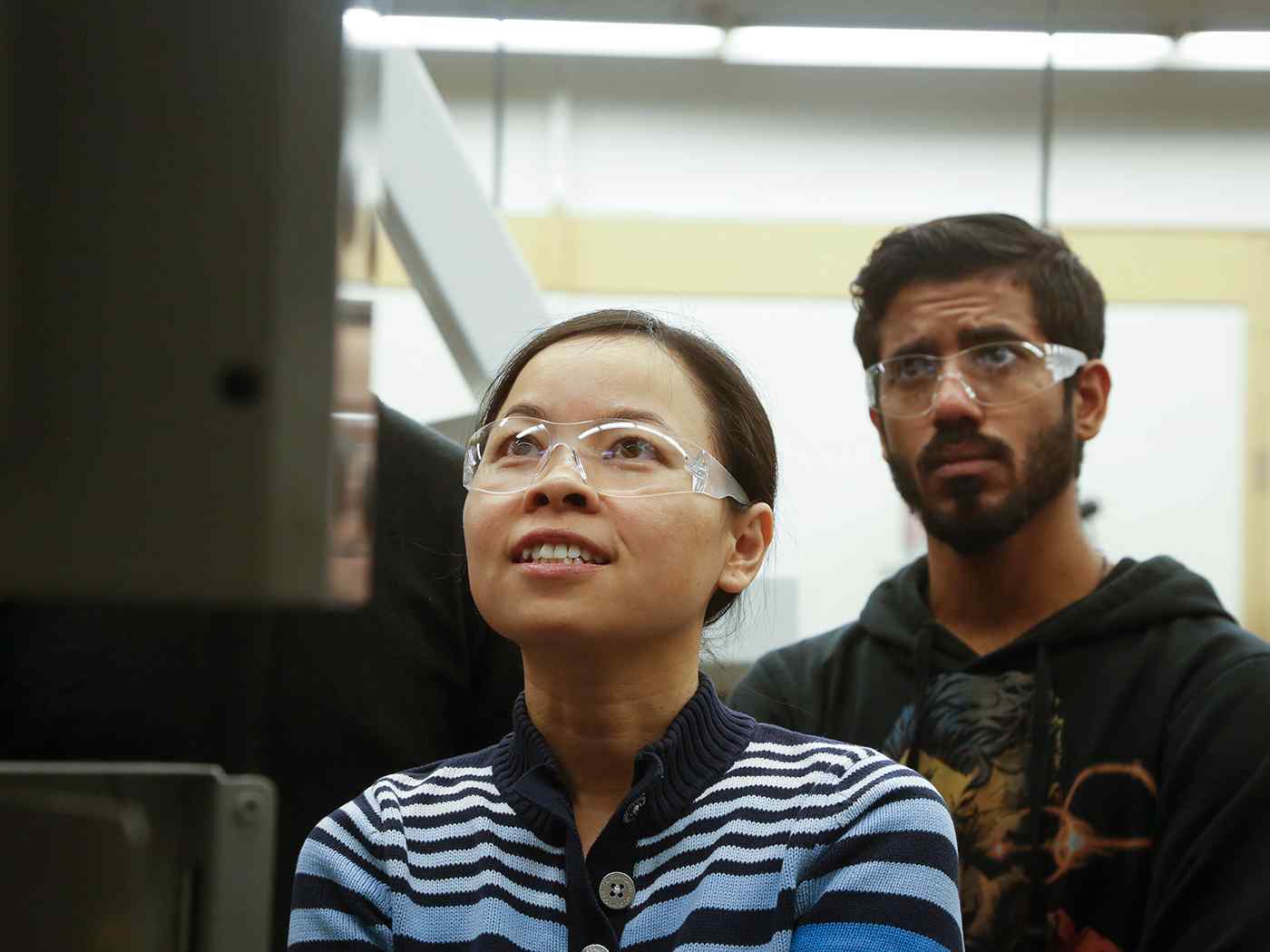 Graduate students working in NIAR lab.