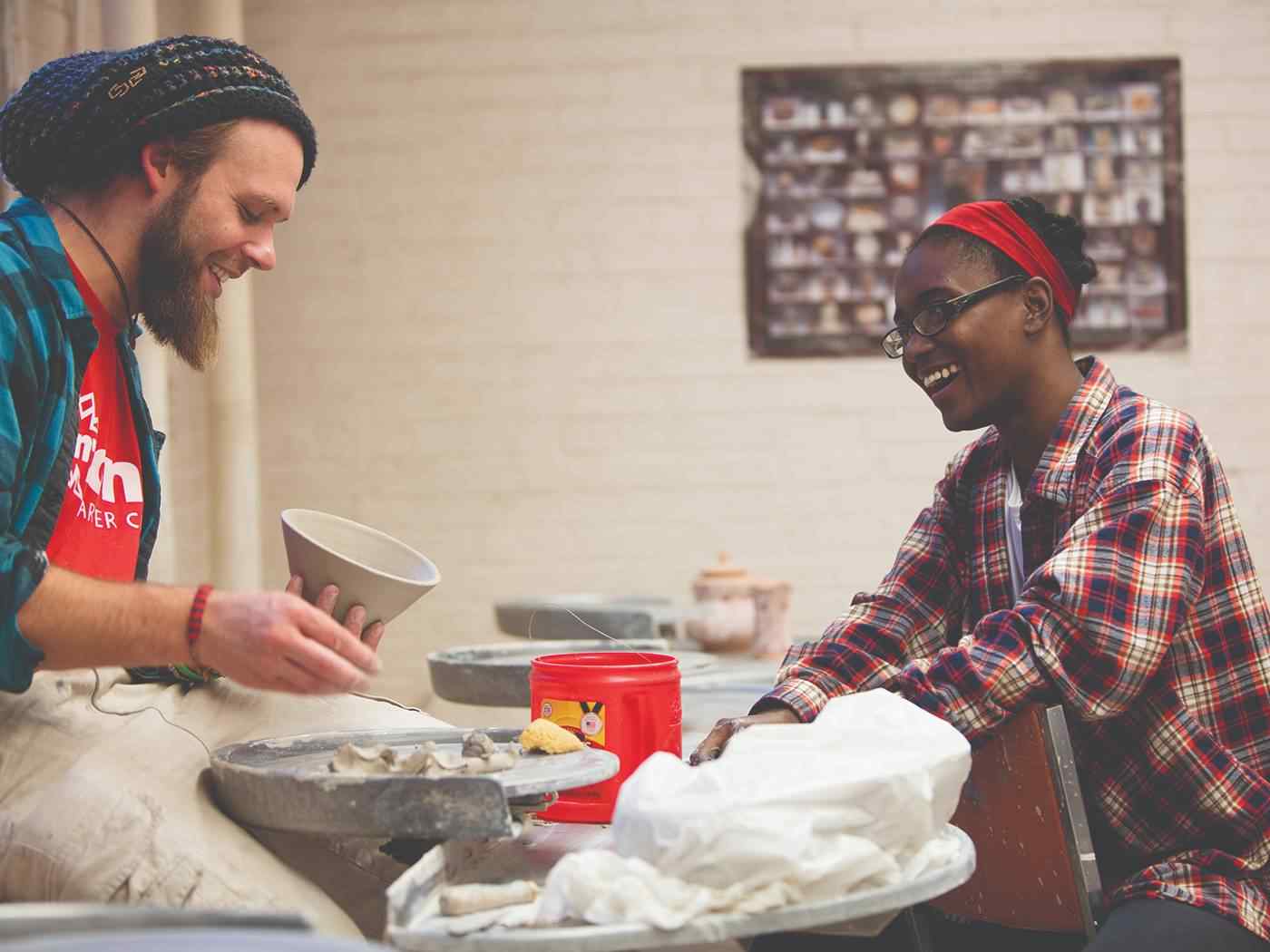 Two students making ceramics.