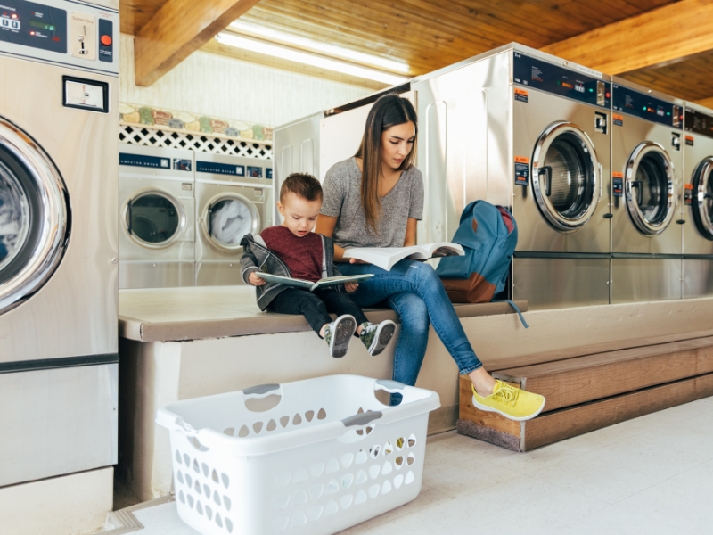 Mom studying at laundry mat