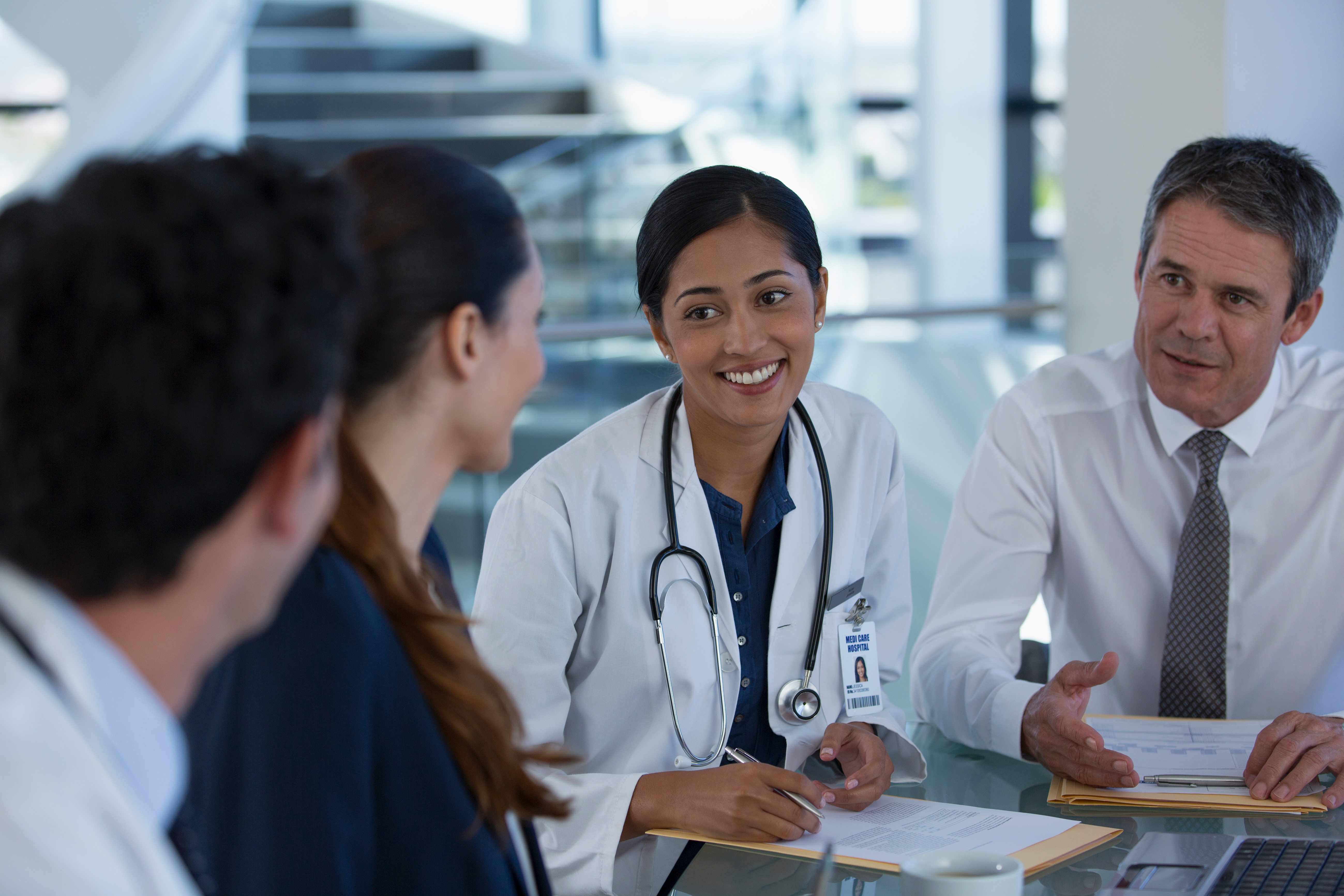 health professionals working together at a table
