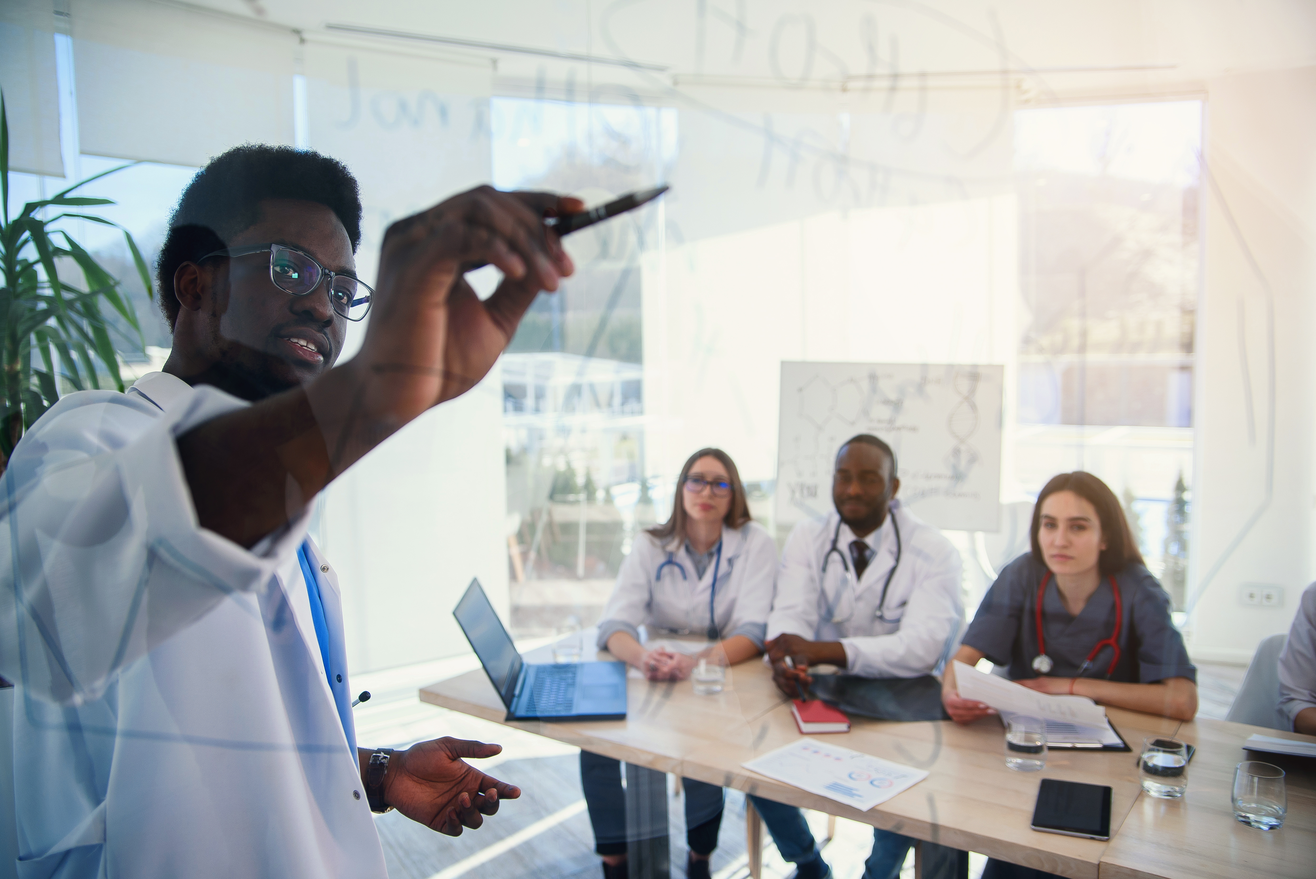 health professionals working together at a table