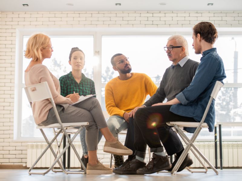 Health professionals in a group setting talking