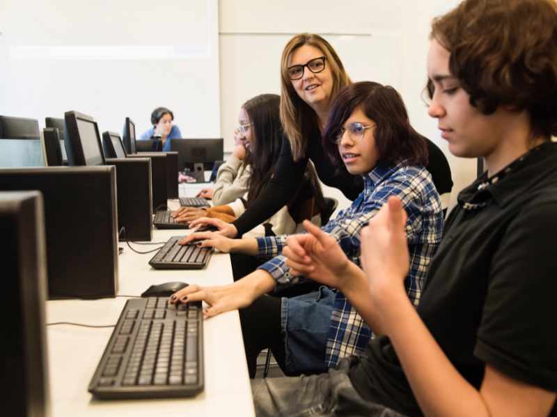 Teacher at a computer lab