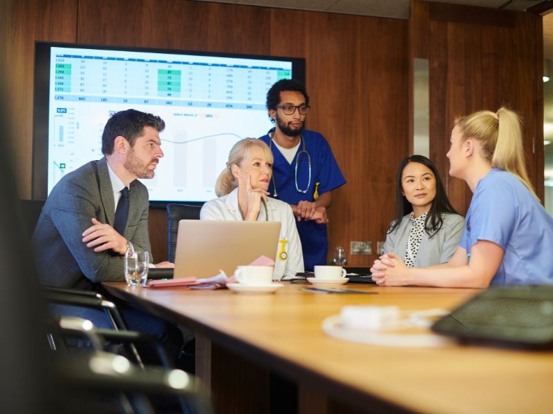 health professionals working together at a table