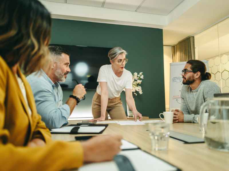 woman leading a discussion at a meeting
