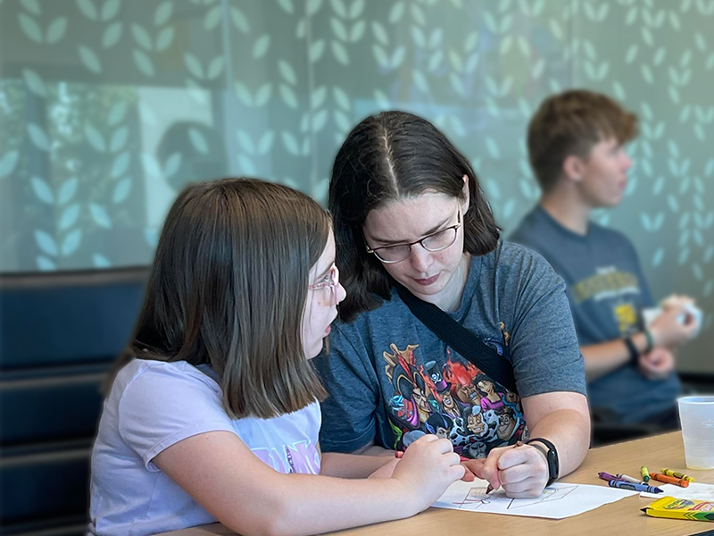 OAL Studdent mom coloring at cartoon event