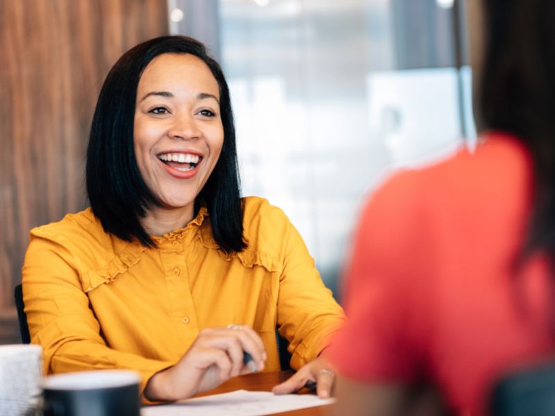 Smiling female over a desk