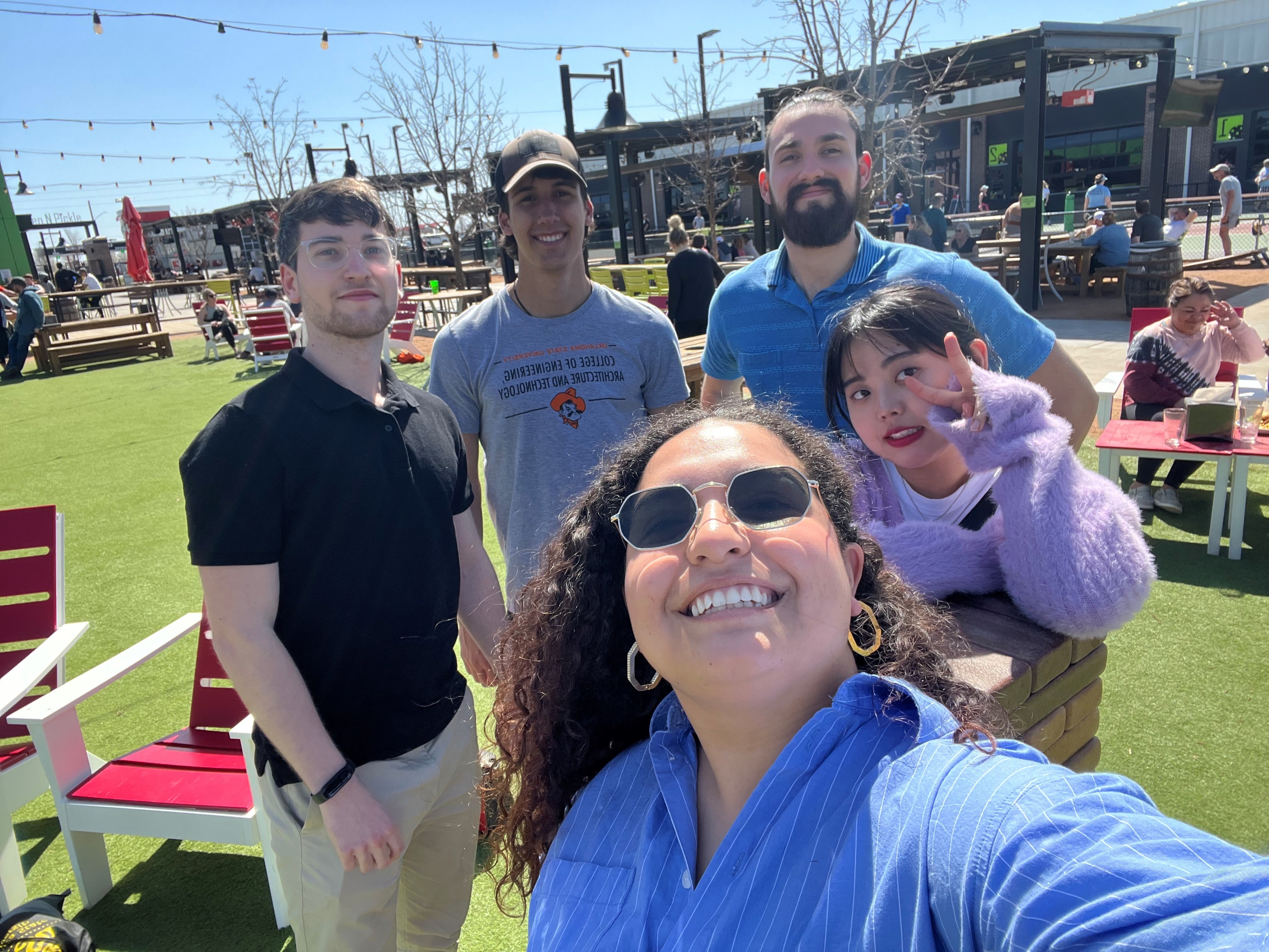 Brent and Lucas with friends at Chicken and Pickle
