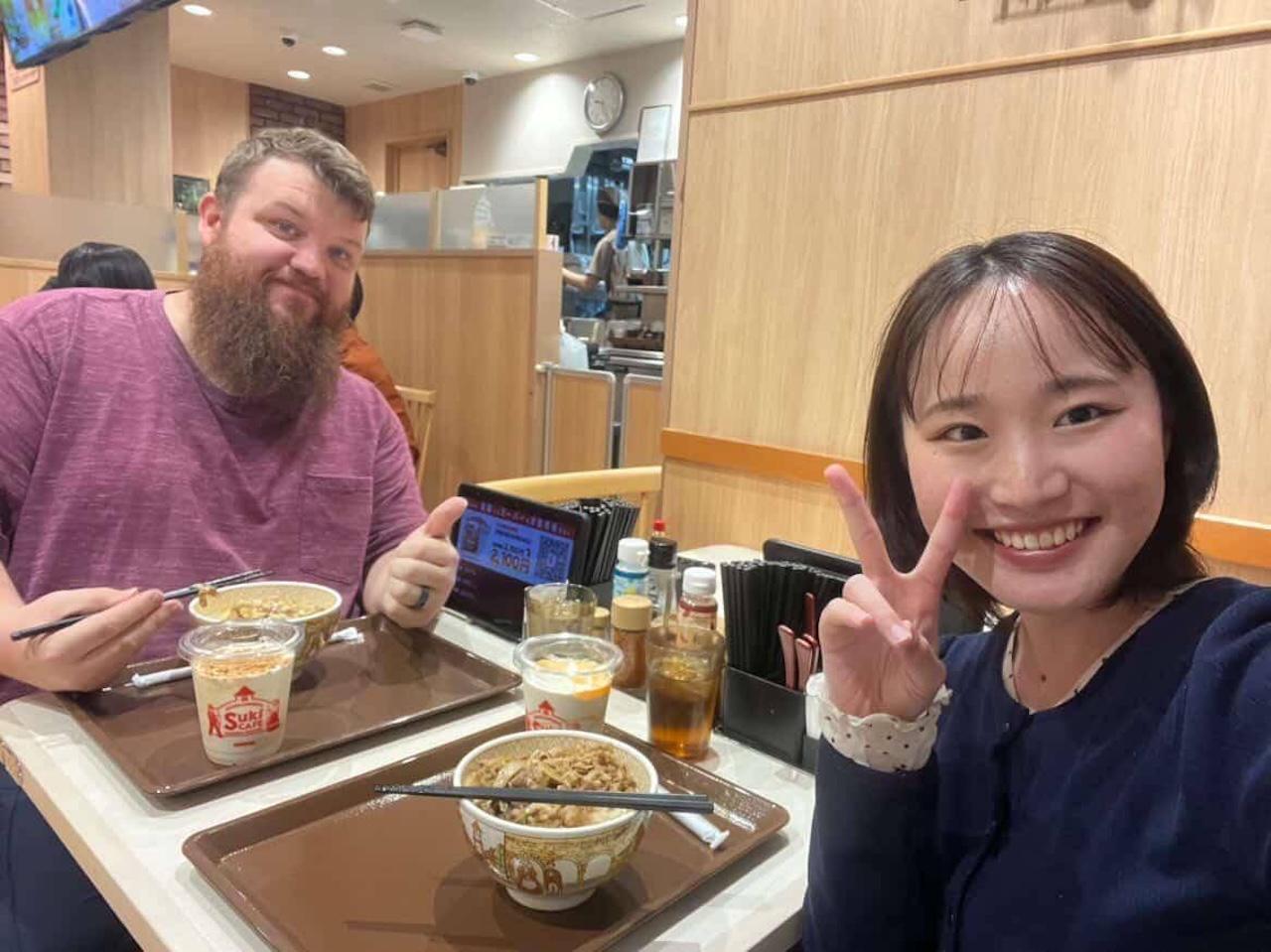 Anthony eating lunch with friend