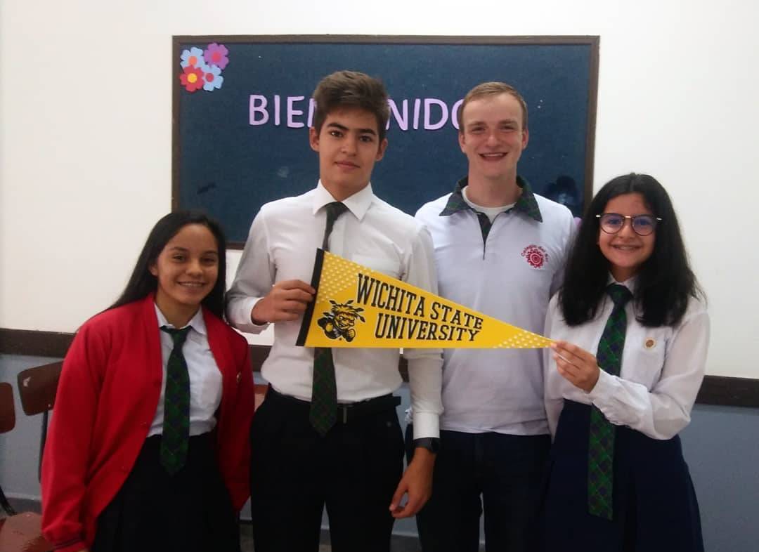 Sam with students