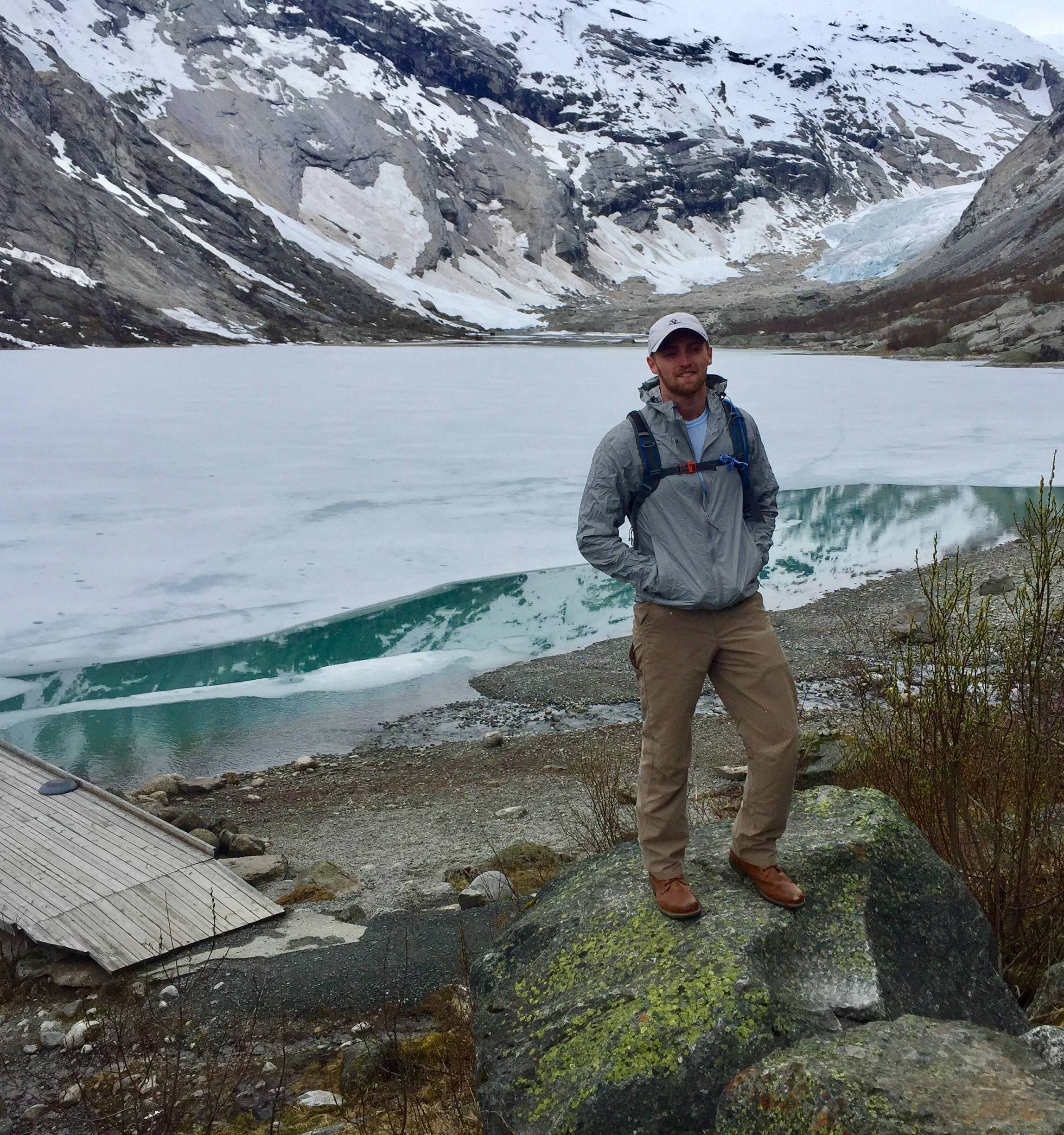 Student with mountain lake