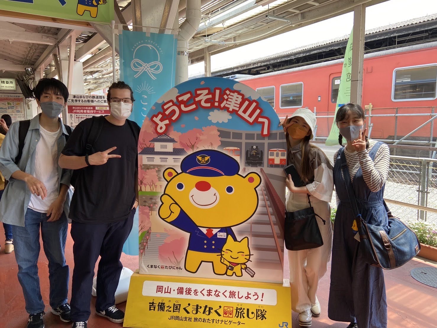 Daniel with friends and cartoon cut out