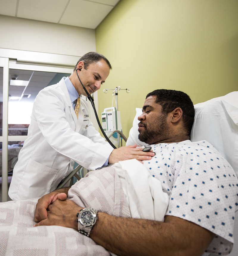 WSU physician assistant student checks a patient