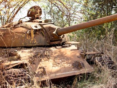 Rusted tank in brush 