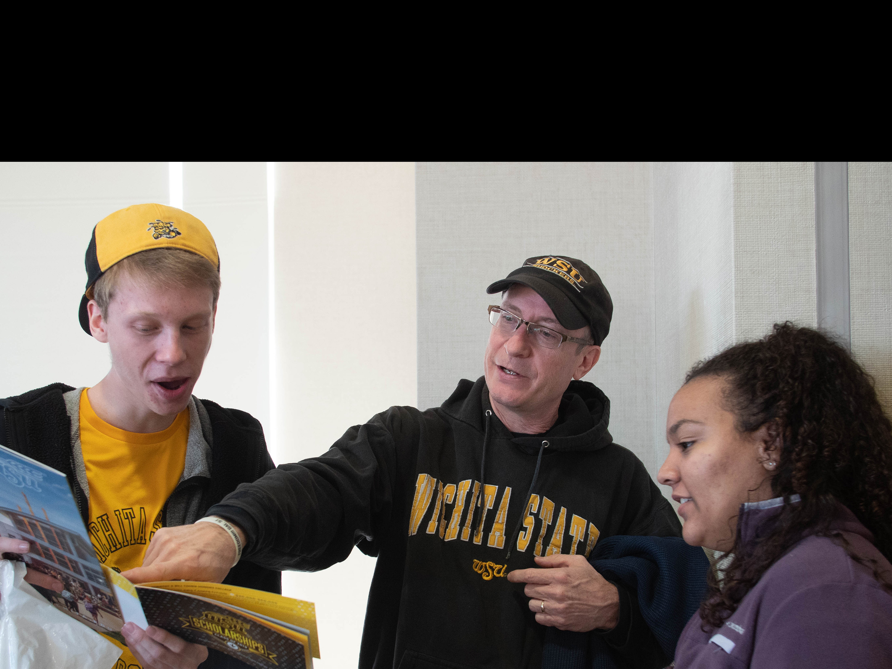 Dad looking at guide with son