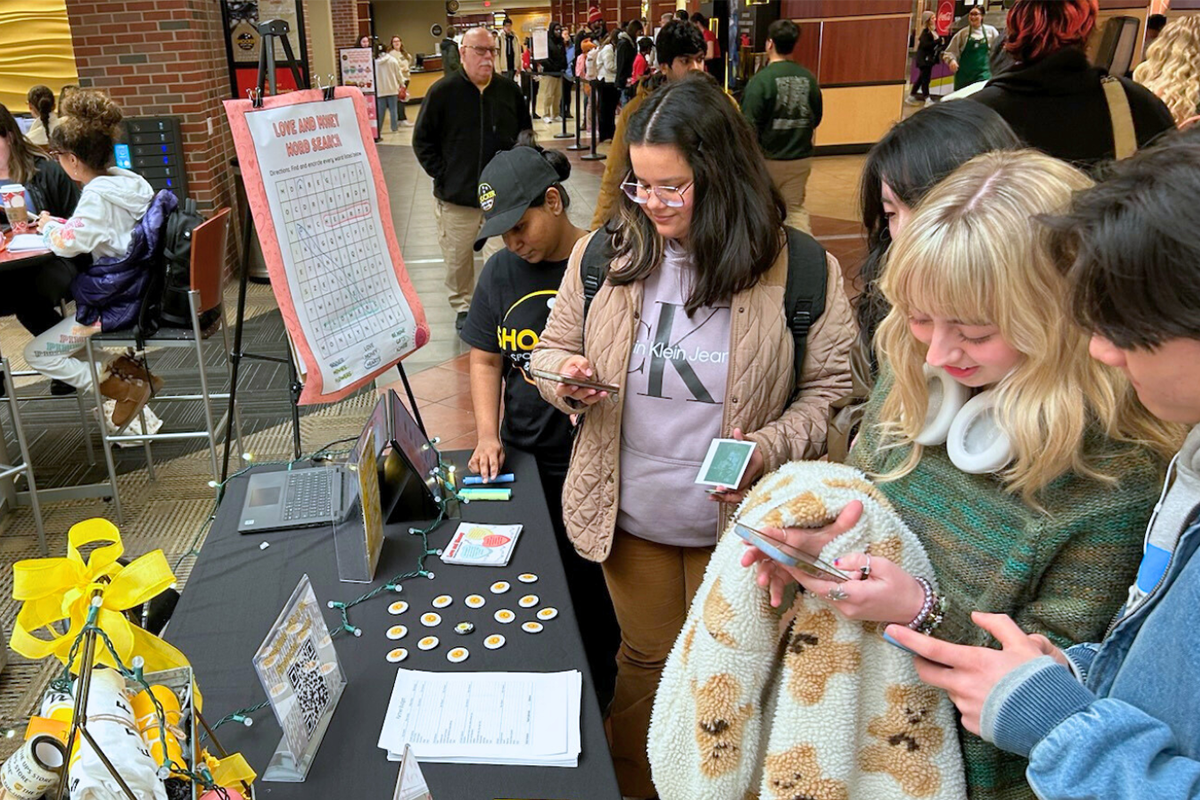 Group of students looking at a SFW table.