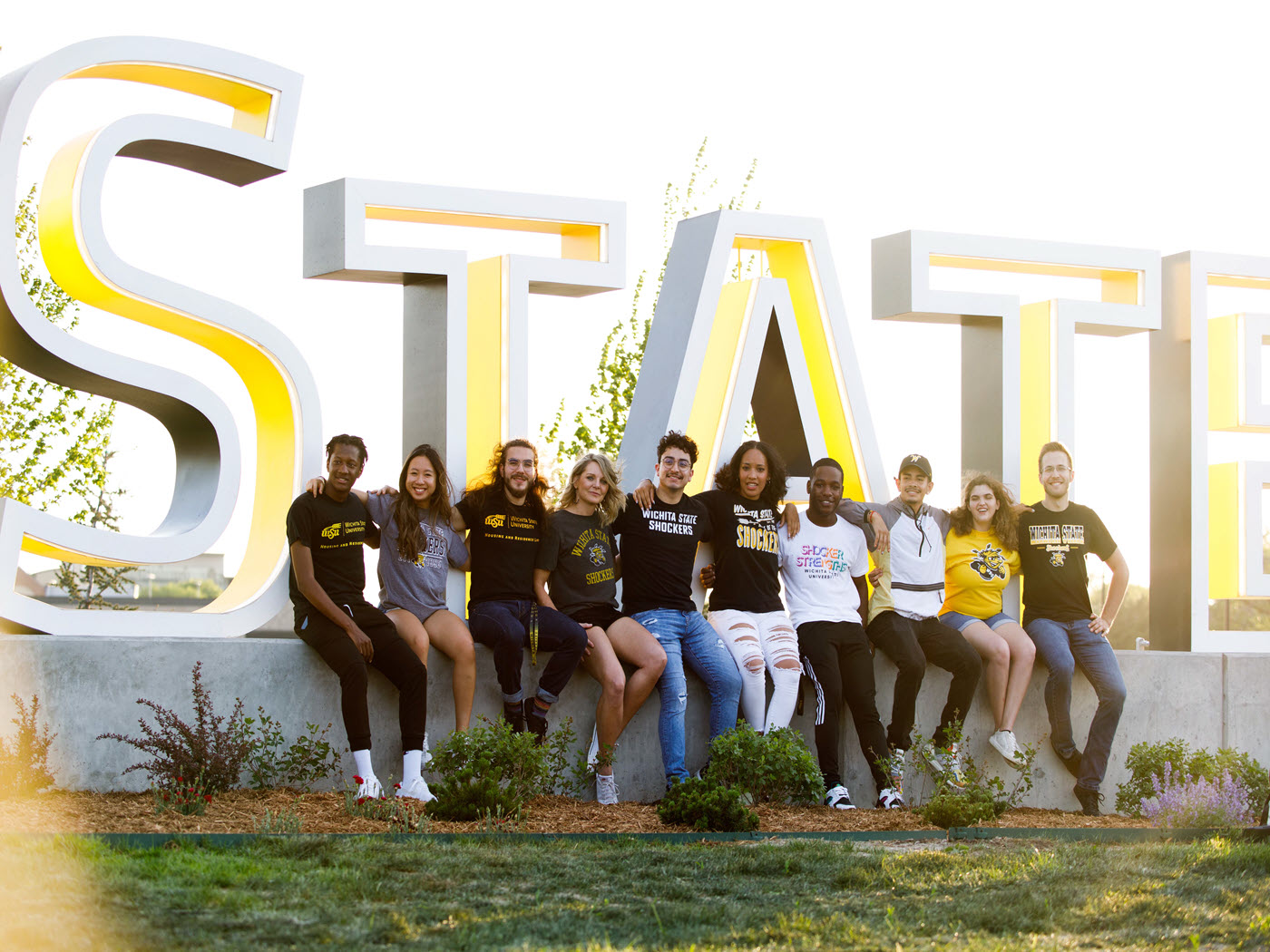 Students in front of Wichita State sign