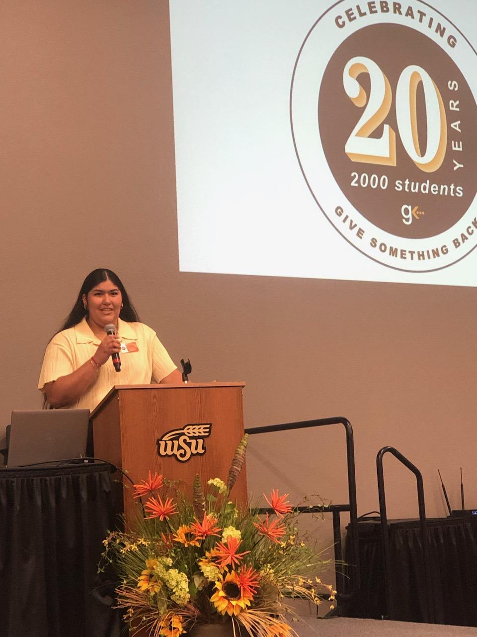 Photo of a student speaking at theansas Give Back 20th Anniversary Celebration