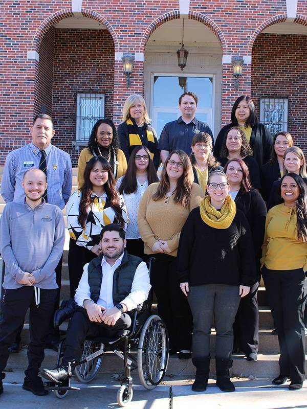 advising team standing in front of morrison