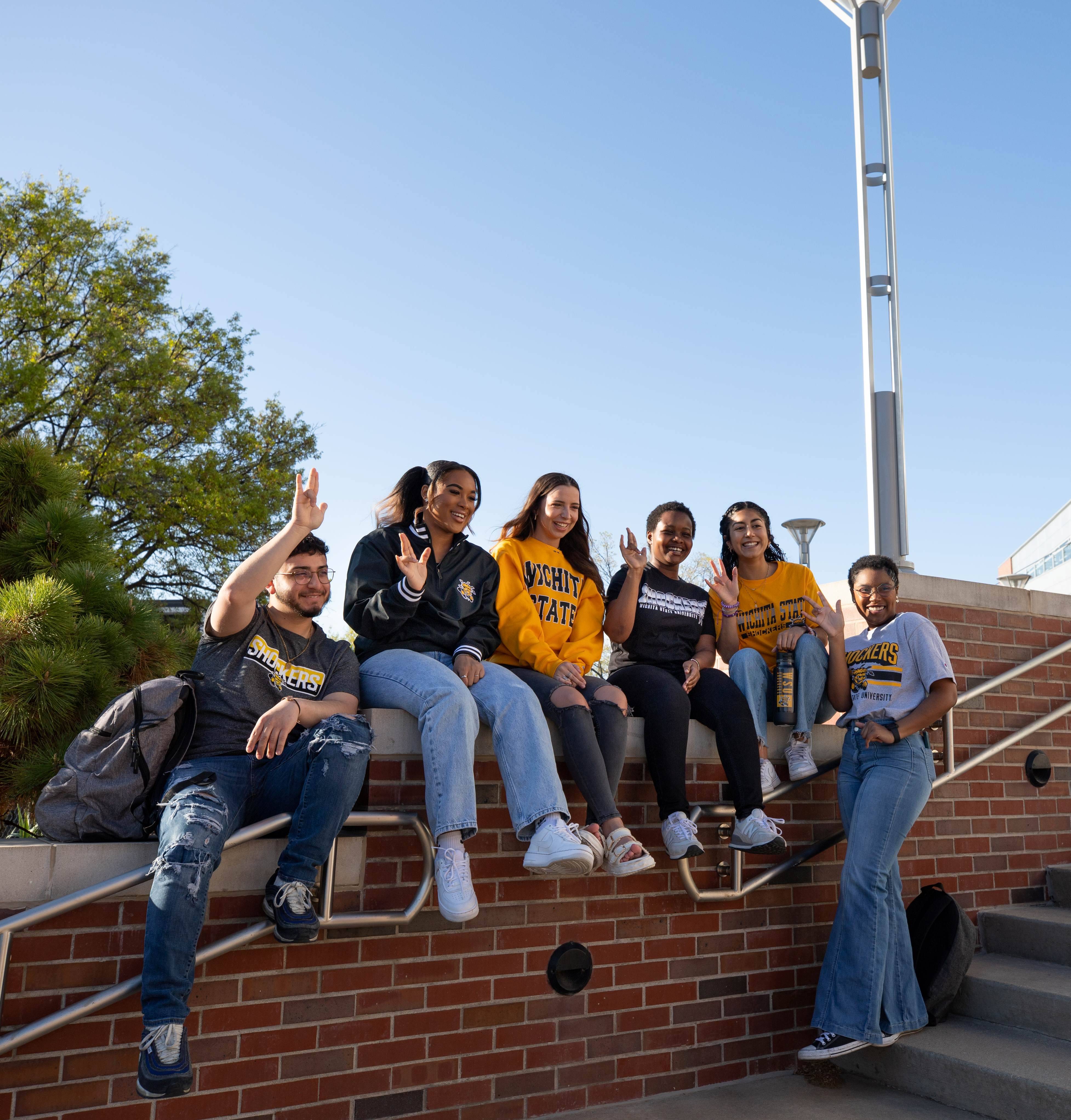 Students walking inside Woolsey hall on the stairs
