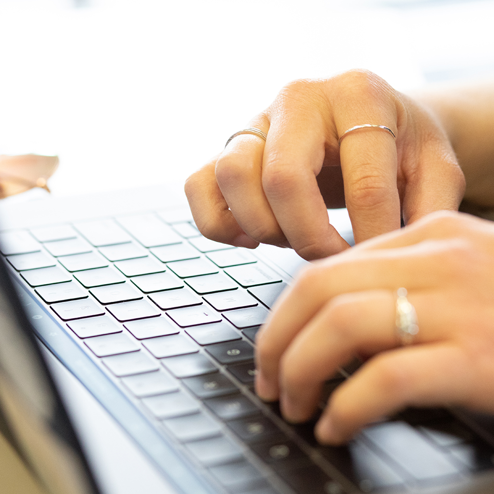 Hands at a keyboard