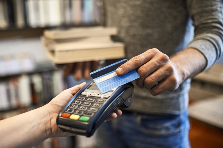 Student buying books with a credit card.