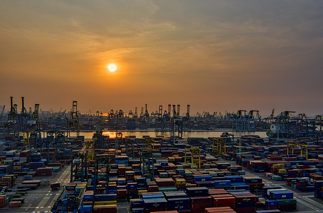 Shipping dock with many shipping containers.