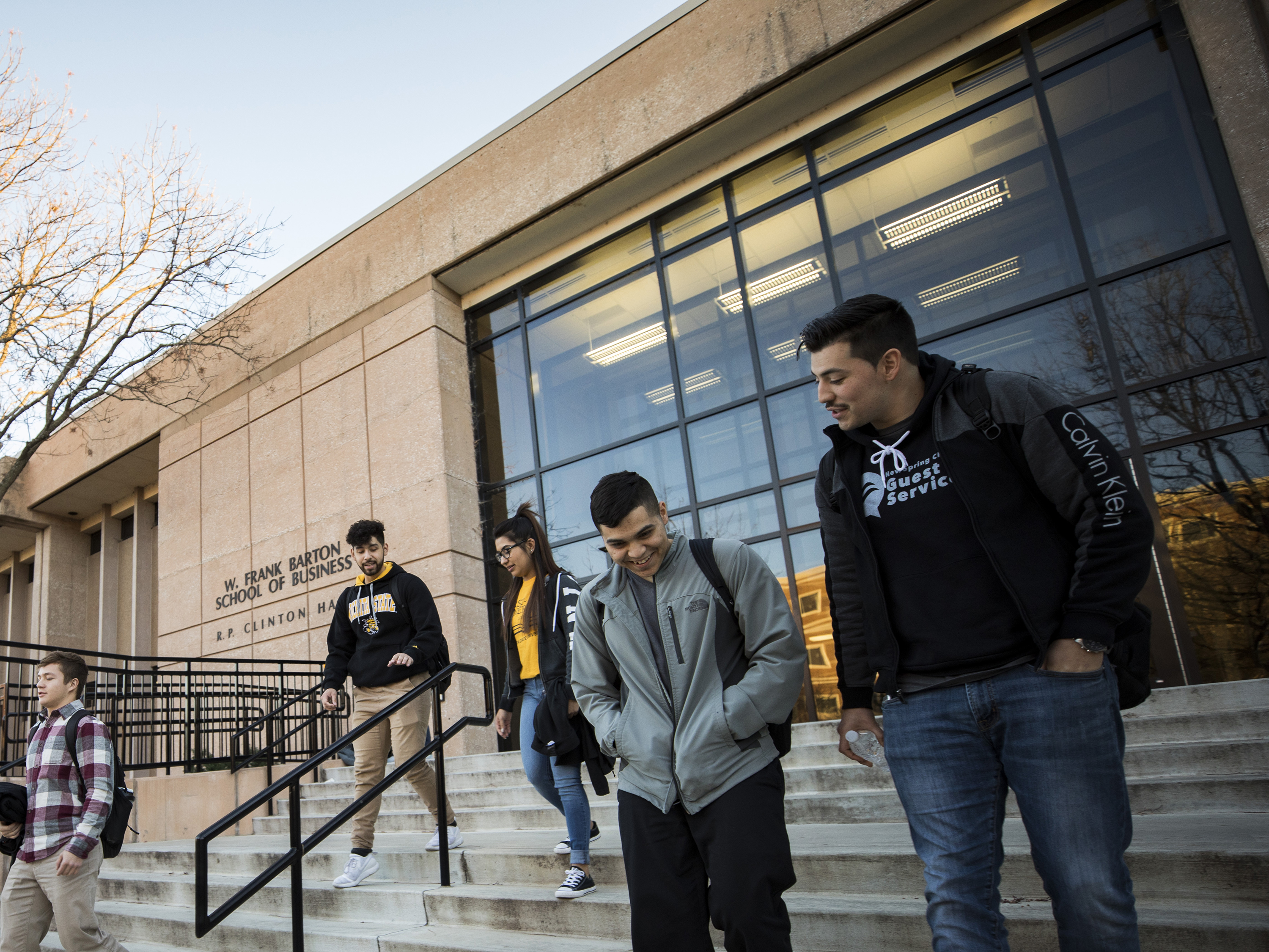 Smiling students walking on campus