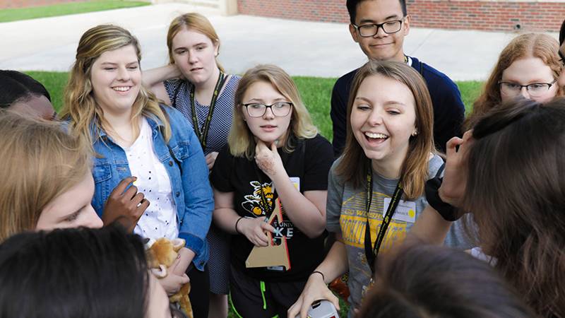 Group of students smiling.