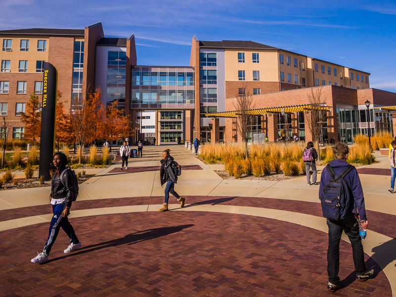 students walking in front of Shocker Hall