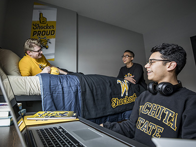 Students hanging out in a dorm room