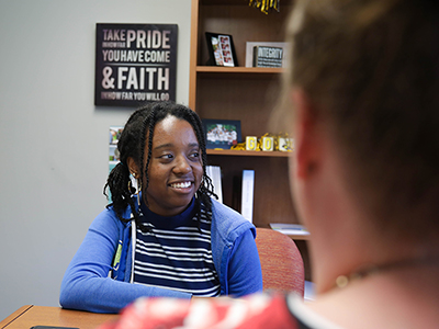 A student meets with their advisor