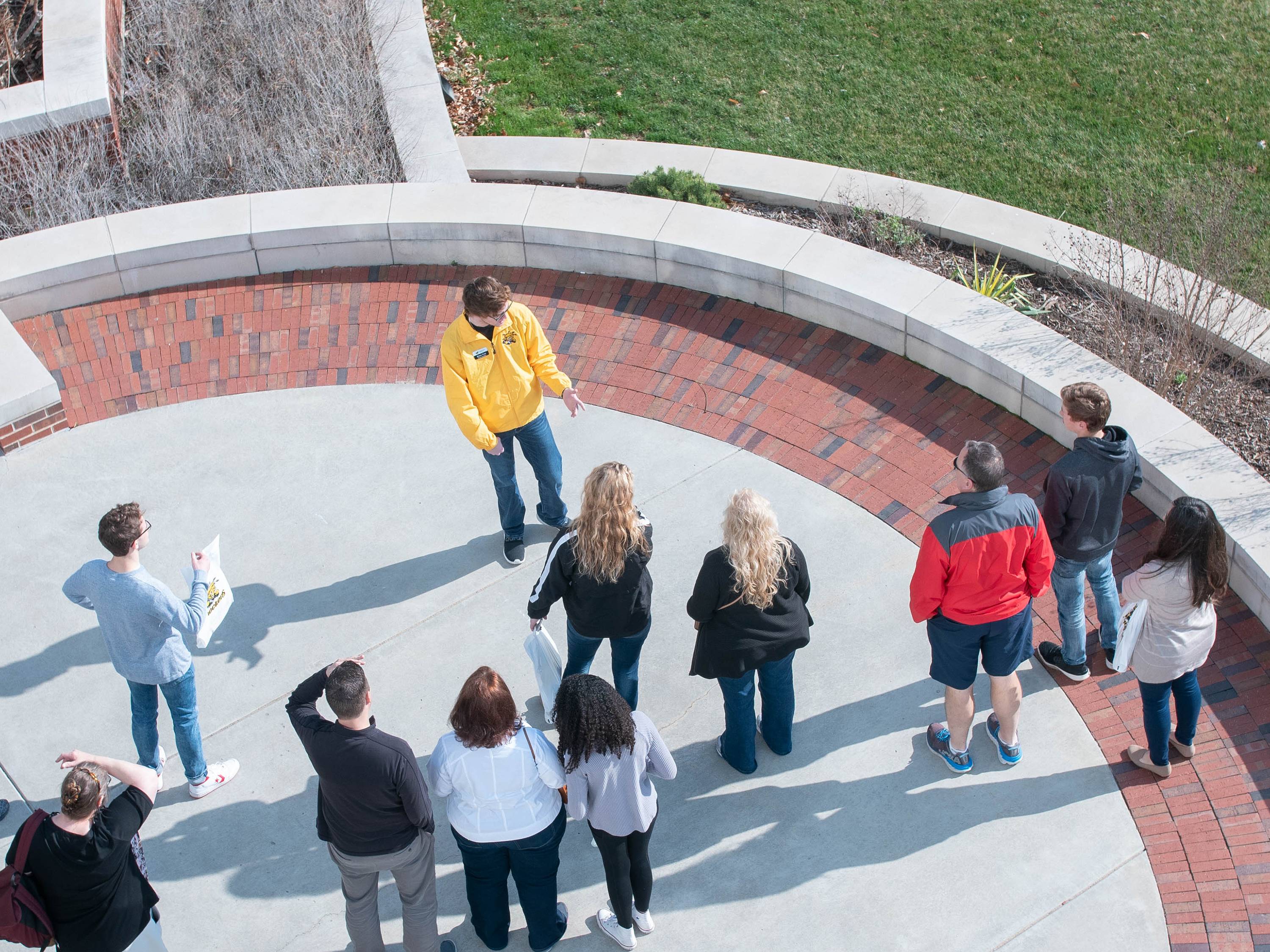 Tour group as seen from overhead, outside the Rhatigan Student Center