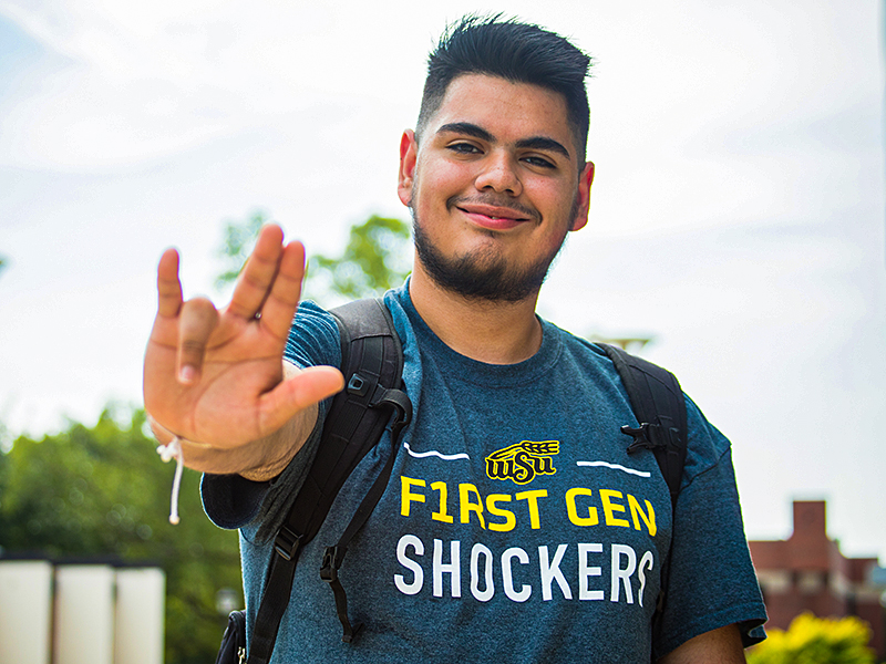 A student shows off the F1RST GEN t-shirt.