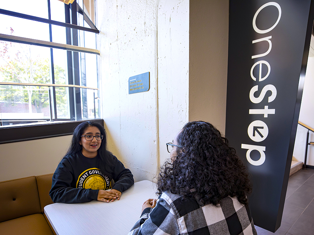Students near OneStop in the Shocker Success Center.