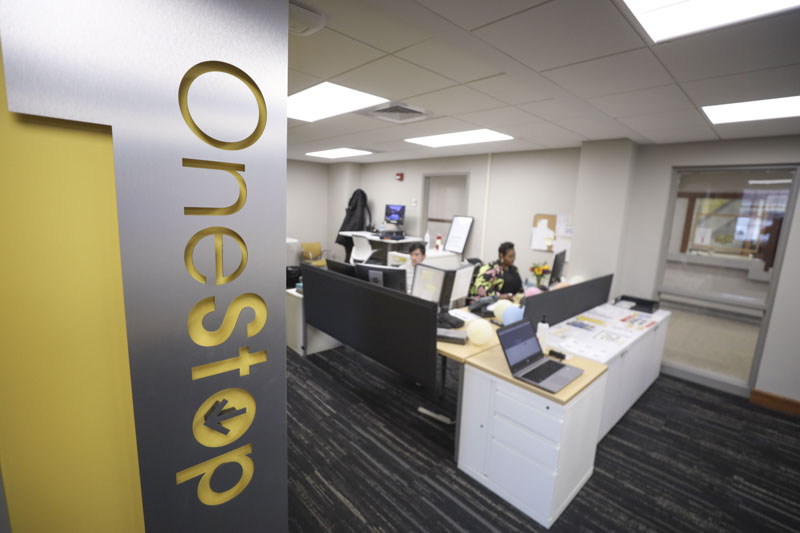 OneStop staff working in office.