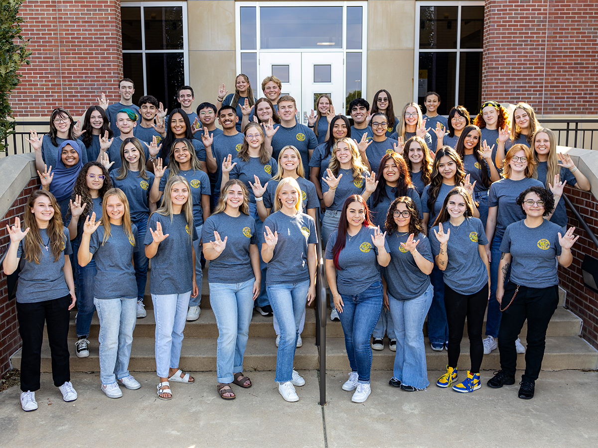 SAS Students in front of the Marcus Welcome Center