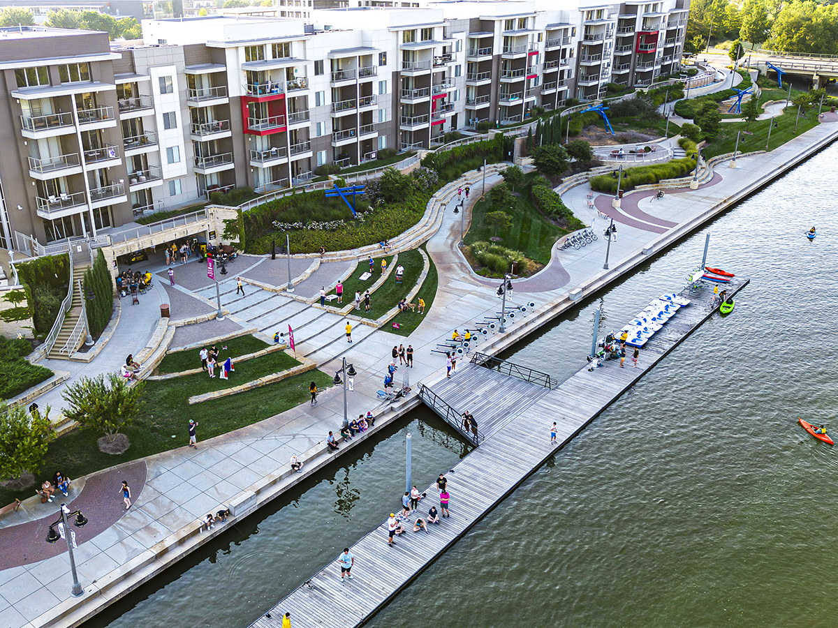 Wichita's Riverwalk filled with attendees at S'mores and Oars near the River Vista Apartments on the Arkansas River.