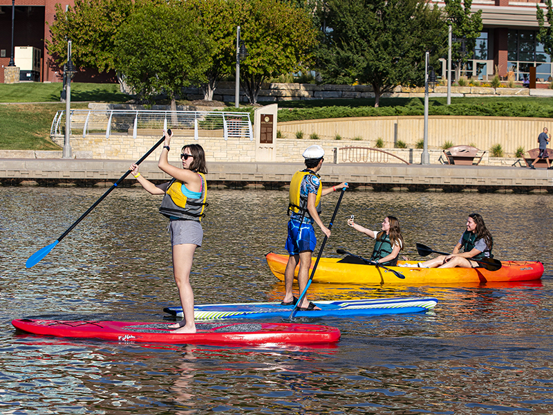 Students enjoying time on the Arkansas River in downtown Wichita.