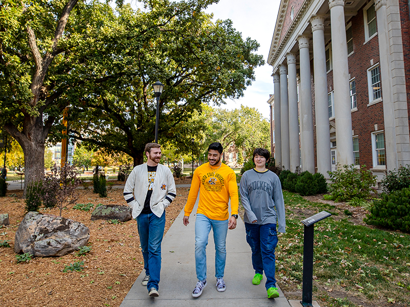 Students walking by Jardine Hall at Wichita State.