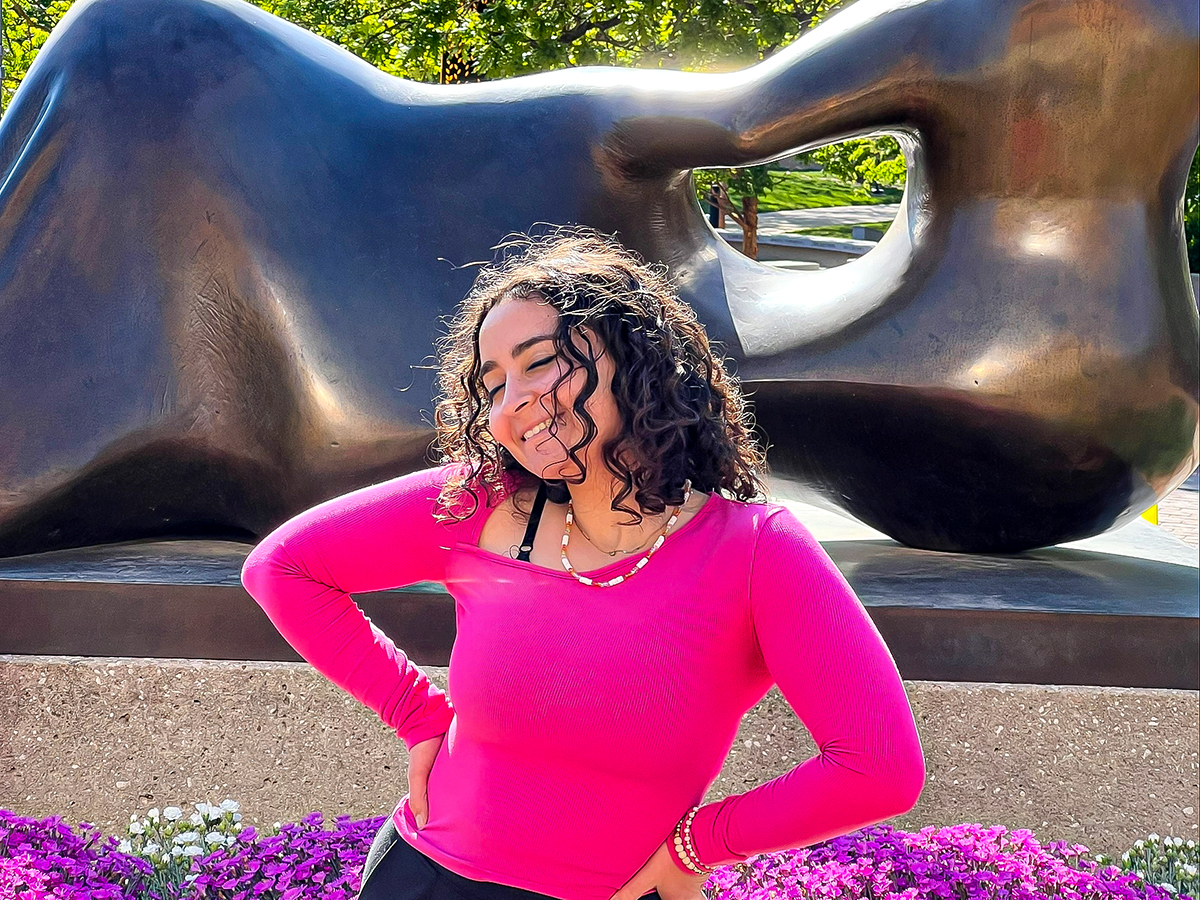 Anna Brake poses for a photo outside of Ablah Library.