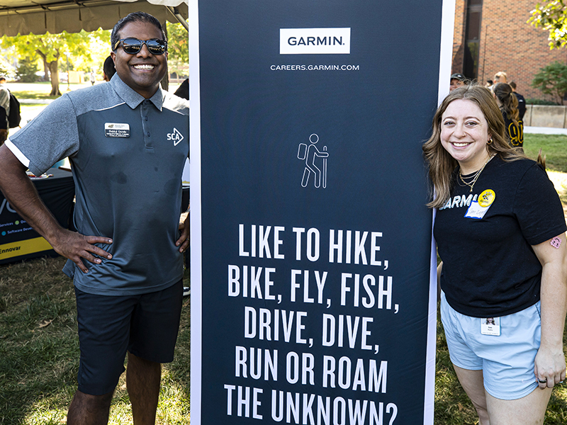 Bobby Gandu, Associate VP, Strategic Enrollment Management, Applied Learning & Director of Admissions, and Sam Zupka, Wichita State alum and Garmin representative, pose for a photo during the 2024 Shocker Career Acclerator Root Beer Kegger.