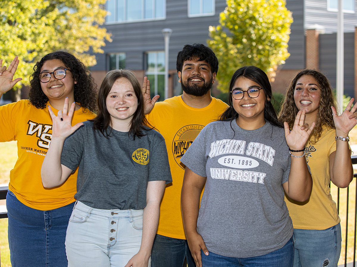 Yovani Cruz, back row, center, is a transfer guide for the Office of Admissions.